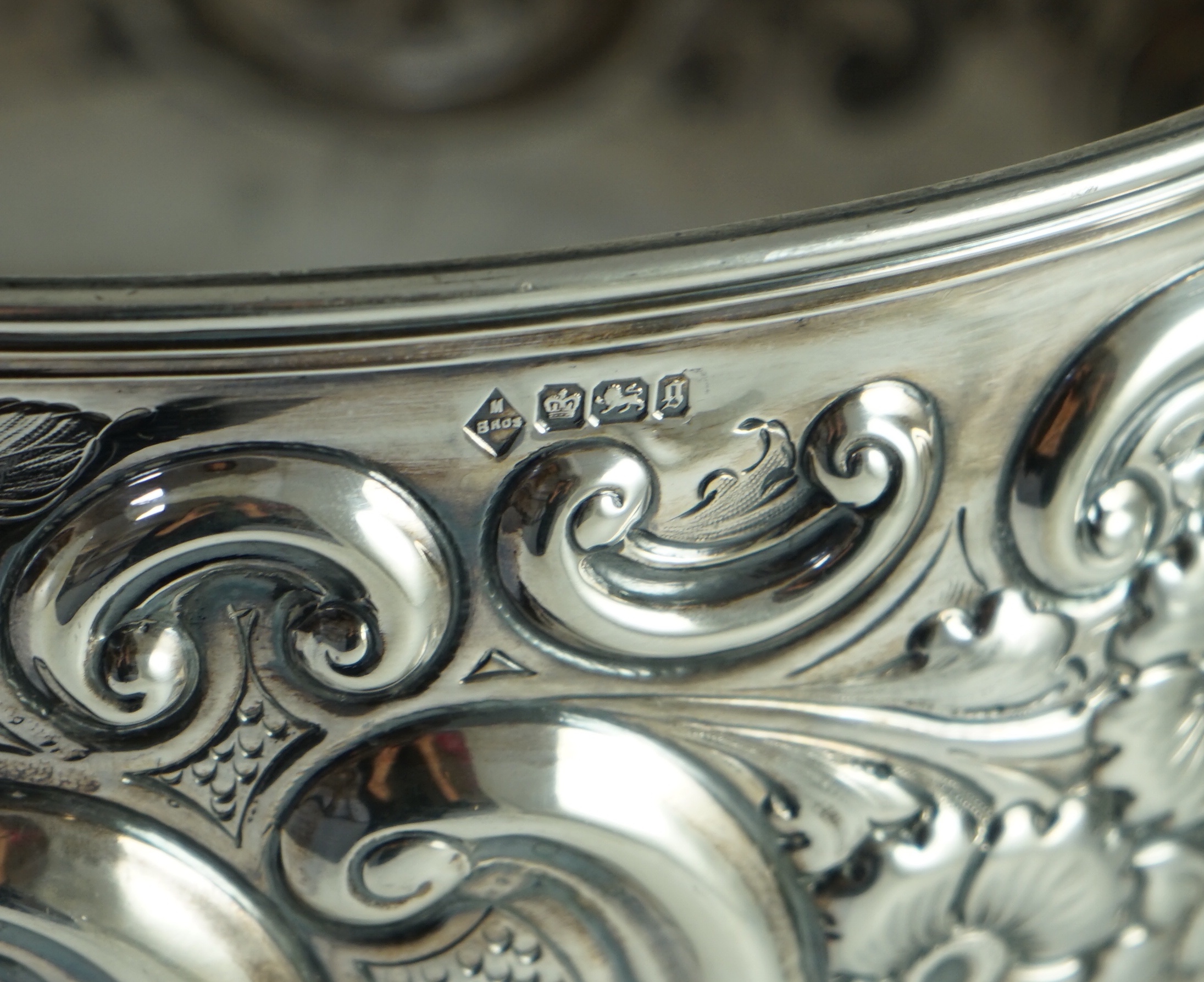 A late Victorian embossed silver pedestal punch bowl by Mappin Brothers (a.f.)